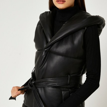 River Island Black faux leather quilted gilet – womens padded gilets – hooded jackets – tie waist belt - flipped