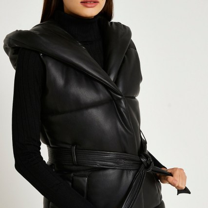 River Island Black faux leather quilted gilet – womens padded gilets – hooded jackets – tie waist belt