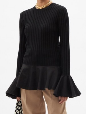 JW ANDERSON Fluted ribbed-knit wool-blend sweater in black | peplum hem sweaters | womens chic knitwear | feminine jumpers - flipped