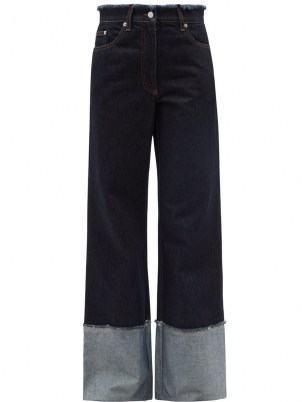JW ANDERSON Logo-embroidered raw-edge wide-leg jeans | womens dark blue denim | women’s deep turn-up hem jeans
