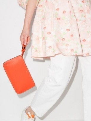 Chloé Darryl orange leather clutch bag | women’s bright designer bags | womens minimalist accessories