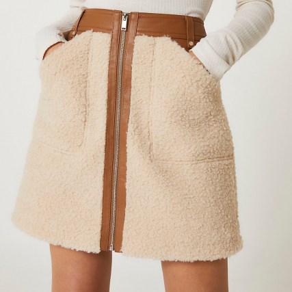 River Island Cream faux leather and borg zip mini skirt | textured faux shearling slip pocket detail skirts | fluffy fashion - flipped
