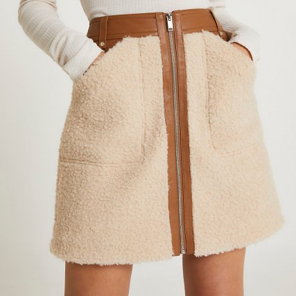 River Island Cream faux leather and borg zip mini skirt | textured faux shearling slip pocket detail skirts | fluffy fashion