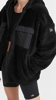 Alo Yoga Cargo Sherpa Jacket in Black – textured sports style jackets