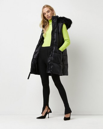 River Island Black padded longline gilet – womens puffer style gilets with faux fur lined hood - flipped