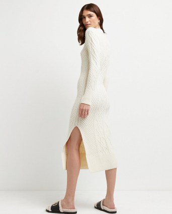 River Island Cream chunky cable knit midi dress | long sleeve high neck split hem knitted dresses | womens on trend knitwear