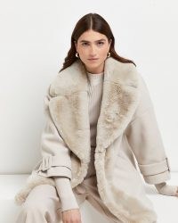 River Island Cream faux fur trim swing coat – women’s luxe style winter coats