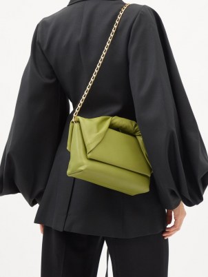 JW ANDERSON Twister green leather shoulder bag | contemporary front flap handbag | chic twisted top handle bags | chain strap handbags