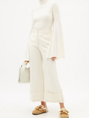 JW ANDERSON Bell-sleeve cotton-knit ribbed sweater | white high neck flared sleeve sweaters | split wide sleeved jumpers | feminine knitwear