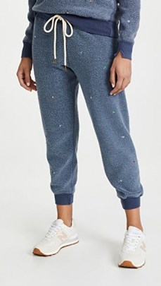 THE GREAT. The Sherpa Cropped Sweatpants with Ditsy Floral Embroidery Vintage Navy / womens blue cuffed joggers / fluffy textured jogging bottoms