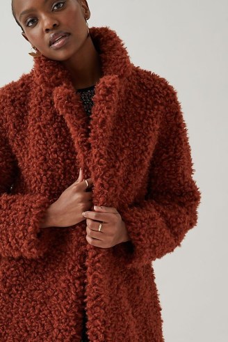 ANTHROPOLOGIE High-Neck Teddy Coat in Terracotta / orange-brown textured coats / faux fur winter coats - flipped