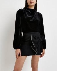 River Island BLACK EMBELLISHED BOW MINI SKIRT | going out evening skirts | party fashion