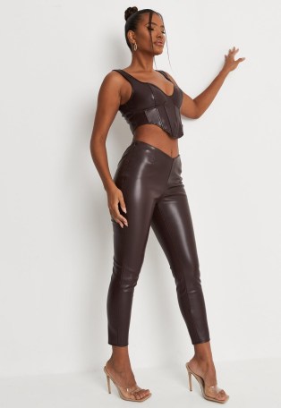 carli bybel x missguided chocolate faux leather v waist fit and flare trousers – crop leg trousers - flipped