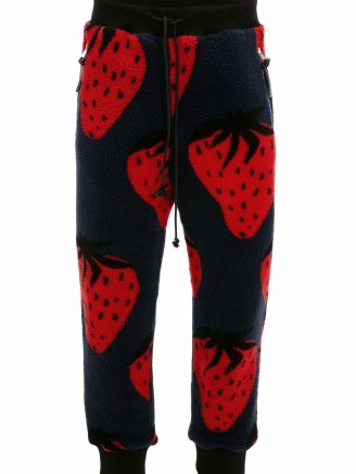 JW Anderson strawberry-print track pants / fleece textured fruit print joggers / unisex jogging bottoms / strawberries on sports fashion - flipped