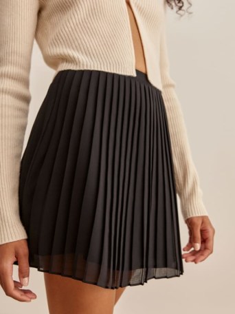 Reformation Lovell Skirt in Black | A-line pleated mini skirts - flipped
