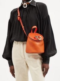 JW ANDERSON Lid chain-embellished orange-leather bucket bag / chic designer shoulder bags / top handle crossbody
