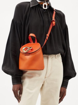 JW ANDERSON Lid chain-embellished orange-leather bucket bag / chic designer shoulder bags / top handle crossbody - flipped