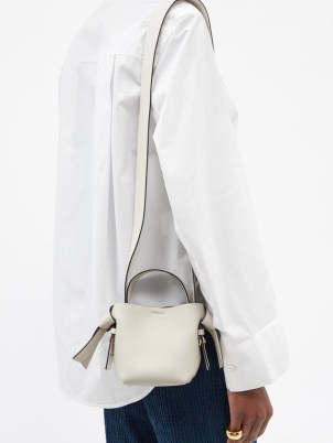 ACNE STUDIOS Musubi micro white leather cross-body bag – cute mini shoulder bags – small top handle crossbody – knotted strap detail handbags - flipped