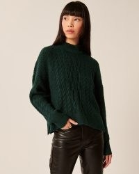 ABERCROMBIE & FITCH Cable Wedge Mockneck Sweater ~ womens dark green relaxed fit sweaters ~ womens high neck side slit jumpers ~ women’s on-trend winter knitwear