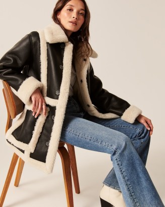 Abercrombie & Fitch Oversized Sherpa-Lined Vegan Leather Shearling Coat in Black ~ luxe style faux leather and faux fur winter coats - flipped