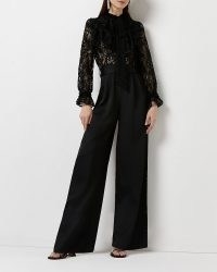 RIVER ISLAND BLACK LACE WIDE LEG JUMPSUIT / semi sheer evening occasion jumpsuits / feminine and romantic party fashion