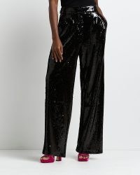 RIVER ISLAND BLACK SEQUIN WIDE LEG TROUSERS / womens sequinned evening pants / women’s glamorous party fashion