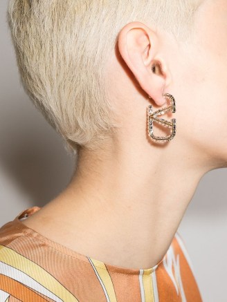 Valentino Garavani crystal-embellished Vlogo earring – single logo earrings – clear white crystals – womens designer statement jewellery - flipped
