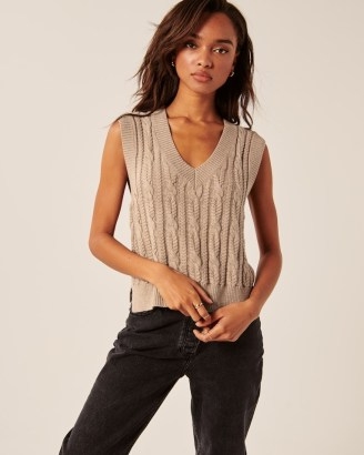 Abercrombie & Fitch Cropped V-Neck Sweater Vest – light brown knitted tanks – side slit cable knit tanks – women’s fashionable knitwear – womens on trend sleeveless vest tops