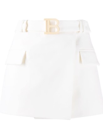 Balmain wraparound white cotton utility skirt. DESIGNER POCKET DETAIL MINI SKIRTS
