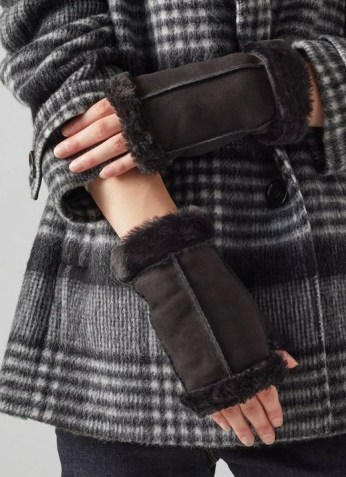 CAITRIN BLACK SHEARLING FINGERLESS MITTENS / l.k. bennett winter accessories / women’s gloves