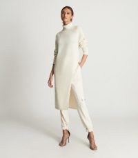 Reiss ELLE ROLL NECK SLIT HEM TUNIC CREAM | chic longline knitted high neck tunics | women’s effortless style fashion | womens stylish minimalist clothing