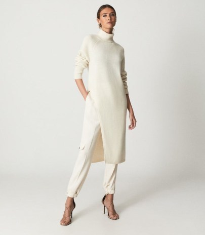 Reiss ELLE ROLL NECK SLIT HEM TUNIC CREAM | chic longline knitted high neck tunics | women’s effortless style fashion | womens stylish minimalist clothing - flipped