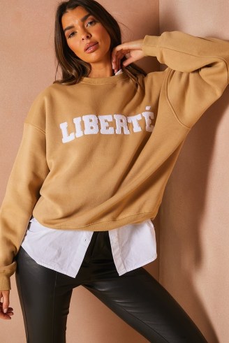 LORNA LUXE TAN TEDDY BORG ‘LIBERTE’ APPLIQUE OVERSIZED SWEATSHIRT ~ light brown slogan sweatshirts ~ womens celebrity inspired sweat tops