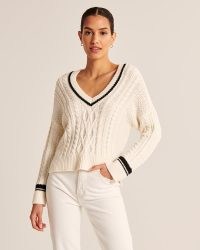 Abercrombie & Fitch Tipped Slouchy Cable V-Neck Sweater | womens off white cricket style jumpers | women’s soft knit sweaters