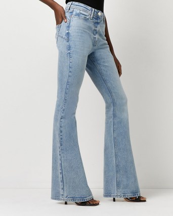 River Island BLUE MID RISE FLARED JEANS | womens Responsibly Sourced Cotton denim flares - flipped
