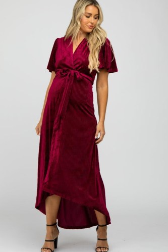 PINKBLUSH Burgundy Pleated Velvet Wrap Maternity Maxi Dress – pregnancy occasion dresses – tie waist evening fashion – dip hem – high low hemline