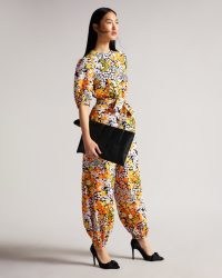 Ted Baker YILENA New World Balloon Leg Jumpsuit with Open Back | floral print cuffed balloon leg evening jumpsuits | retro flower prints | occasion fashion