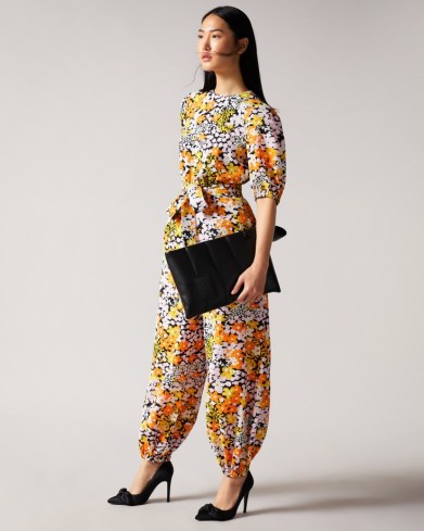 Ted Baker YILENA New World Balloon Leg Jumpsuit with Open Back | floral print cuffed balloon leg evening jumpsuits | retro flower prints | occasion fashion - flipped