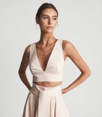 Reiss TAMMI NEUTRAL CROP TOP WITH BOW DETAIL | deep V-neck cropped hem event tops | plunging neckline | occasion fashion