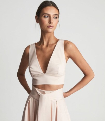 Reiss TAMMI NEUTRAL CROP TOP WITH BOW DETAIL | deep V-neck cropped hem event tops | plunging neckline | occasion fashion