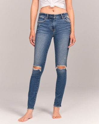 Abercrombie & Fitch Mid Rise Super Skinny Jeans in Ripped Medium Wash | womens blue denim knee rip distressed skinnies - flipped