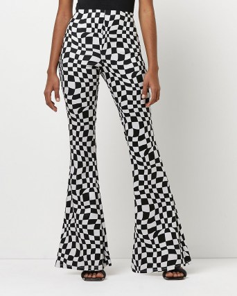 River Island BLACK CHECKERBOARD FLARED TROUSERS | women’s funky retro flares - flipped