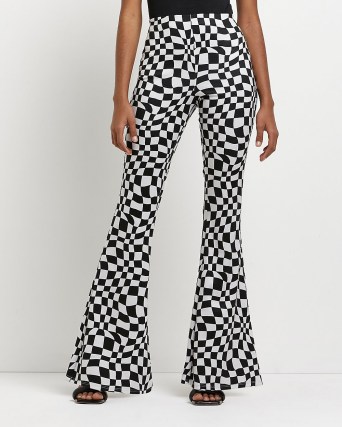 River Island BLACK CHECKERBOARD FLARED TROUSERS | women’s funky retro flares