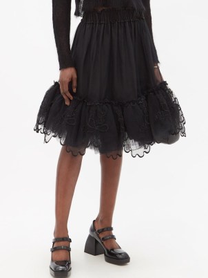 Romance inspired fashion – SIMONE ROCHA Floral-embroidered tulle-trimmed nylon skirt – black romantic style tiered skirts – sheer net overlay fashion - flipped