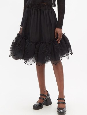 Romance inspired fashion – SIMONE ROCHA Floral-embroidered tulle-trimmed nylon skirt – black romantic style tiered skirts – sheer net overlay fashion