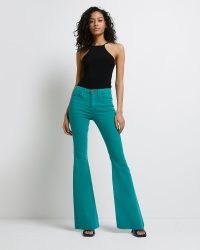 River Island GREEN MID RISE FLARED JEANS – women’s denim flares