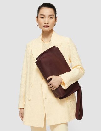 Joseph Leather Clutch Bag in Grape | large wrist strap bags | luxe minimalist handbags - flipped