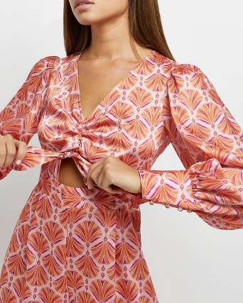 RIVER ISLAND ORANGE PRINTED PLAYSUIT / tie front cut out detail playsuits