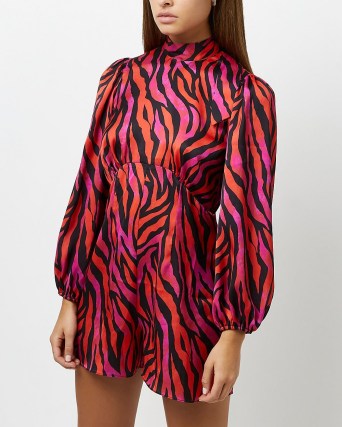 River Island RED ANIMAL PRINT PLAYSUIT – long sleeved high neck playsuits – open tie back detail - flipped