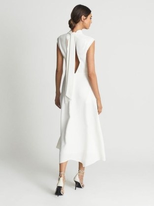 REISS LIVVY Open Back Midi Dress in White – elegant sleeveless high neck fit and flare occasion dresses – tie back detail evening event fashion - flipped